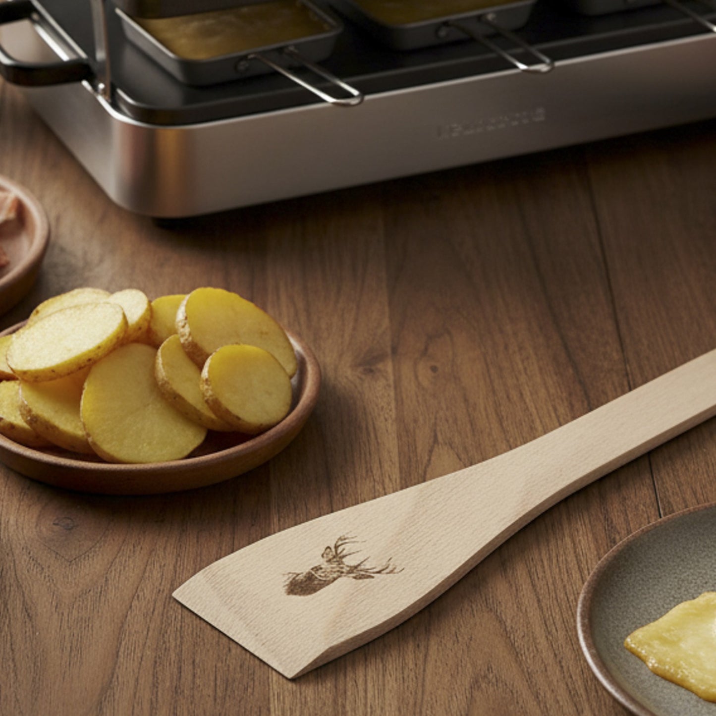 Raclette-Spachtel mit verschiedenen Sujets